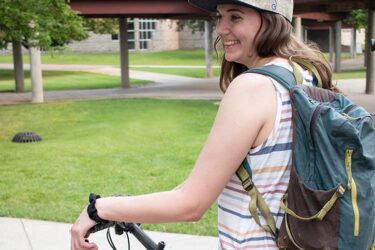 student with bicycle