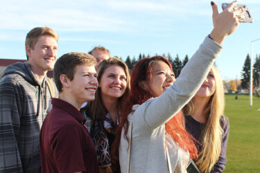 students taking selfie