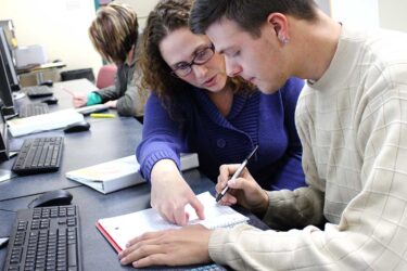 Instructor helping student with math