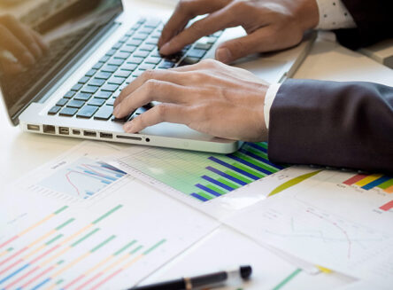 businessman typing on computer