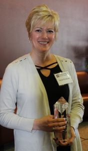 Heidi Emerson portrait holding an award