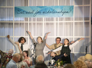 students perform at the bon voyage scholarship dinner