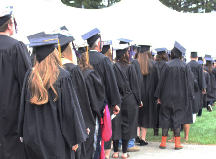 students wearing regalia at commencement ceremony