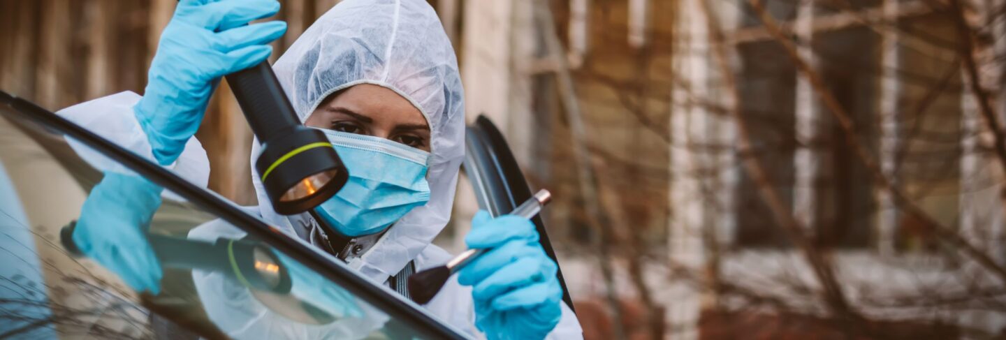 a forensic scientist examines a crime scene
