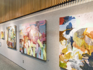 brightly colored abstract artwork featured on the arts and technology building lobby wall