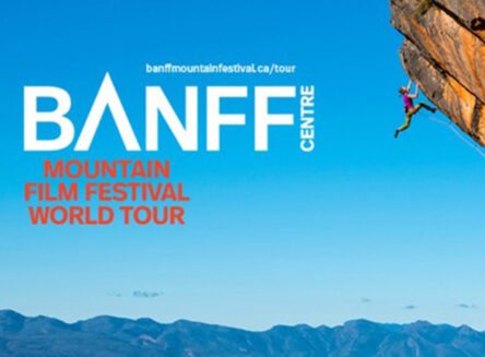 banff mountain film festival graphic featuring a climber scaling a red overhanging cliff with mountains and blue sky in the background