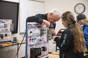 instructor and student working on electrical project