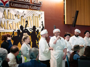 culinary students on stage at the roaring twenties festival of flavors event