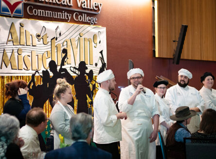 culinary students on stage at the roaring twenties festival of flavors event