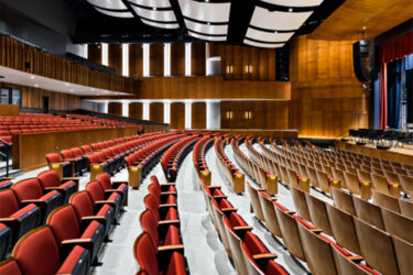 rows of seats inside of a large performance hall