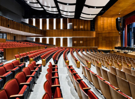 rows of seats inside of a large performance hall