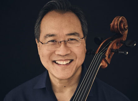 a portrait of the world-famous musician, Yo-Yo Ma, holding a cello
