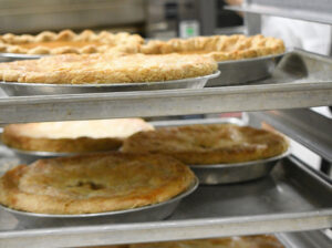 freshly baked pies resting on a rack