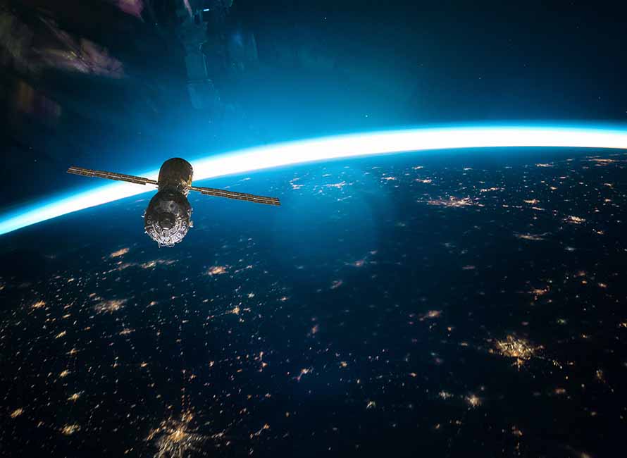 space station against planet Earth orbital sunrise