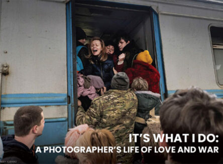 text reads it's what I do: a photographer's life of love and war and an image depicts a chaotic scene of people boarding a train, while one woman looks back towards a crowd that remains