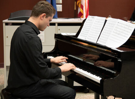 a student playing piano