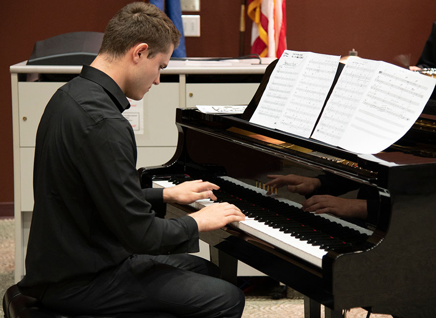 a student playing piano