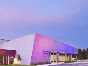 Wachholz College Center with purple lights lighting up face of building