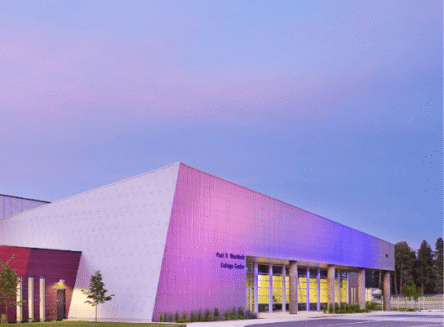 Wachholz College Center with purple lights lighting up face of building