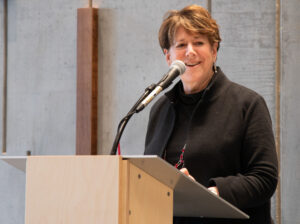 Jane Karas speaking at podium
