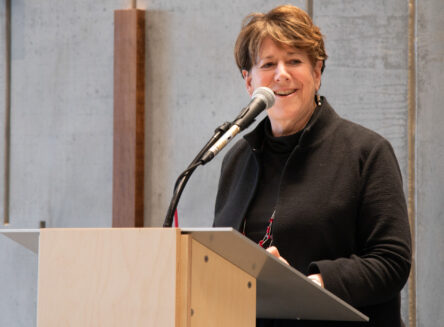 Jane Karas speaking at podium